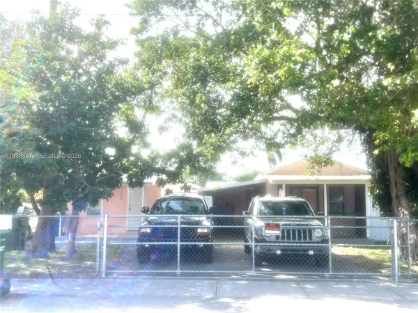a view of a chairs and table in the patio