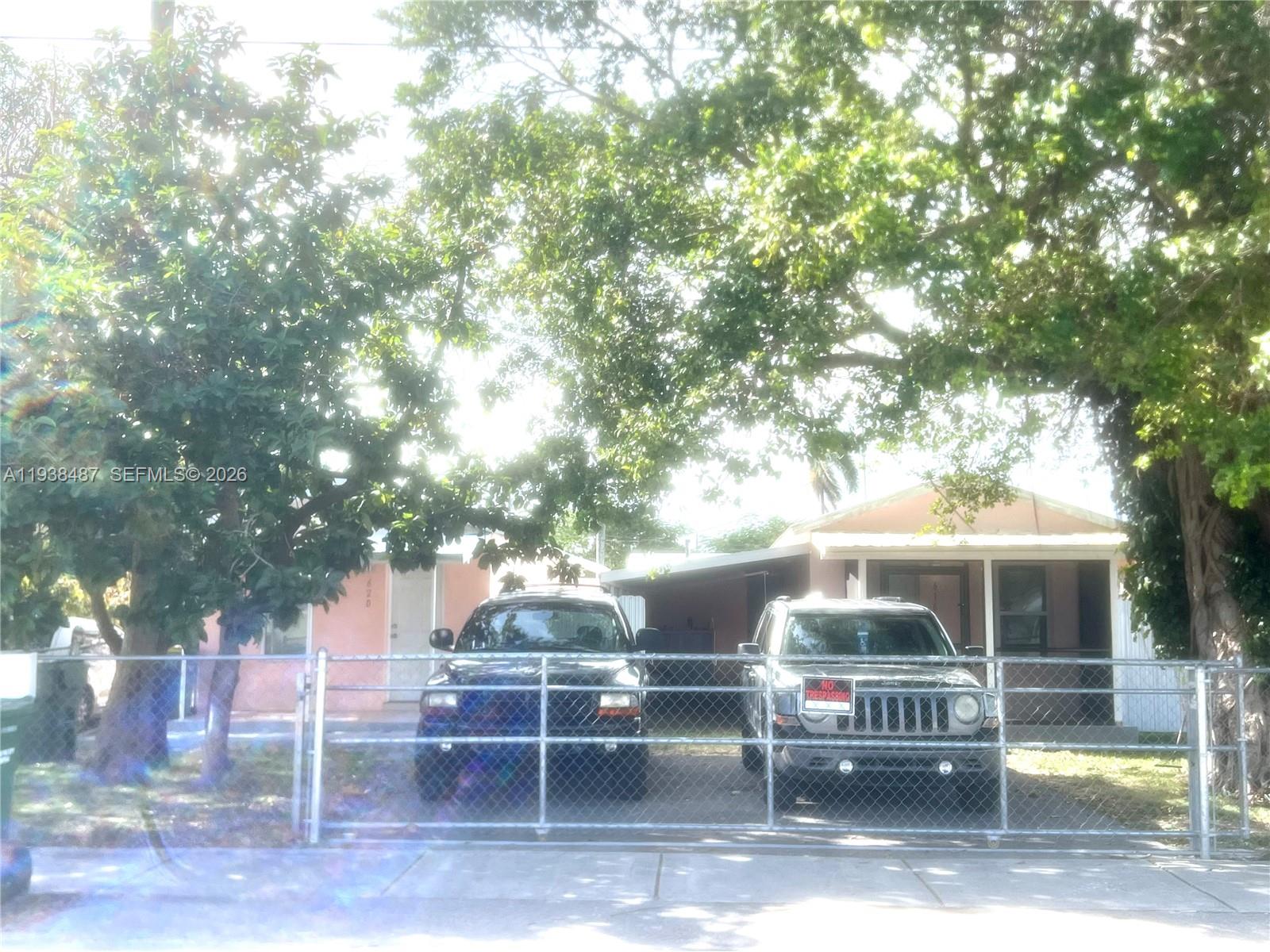 a view of a chairs and table in the patio