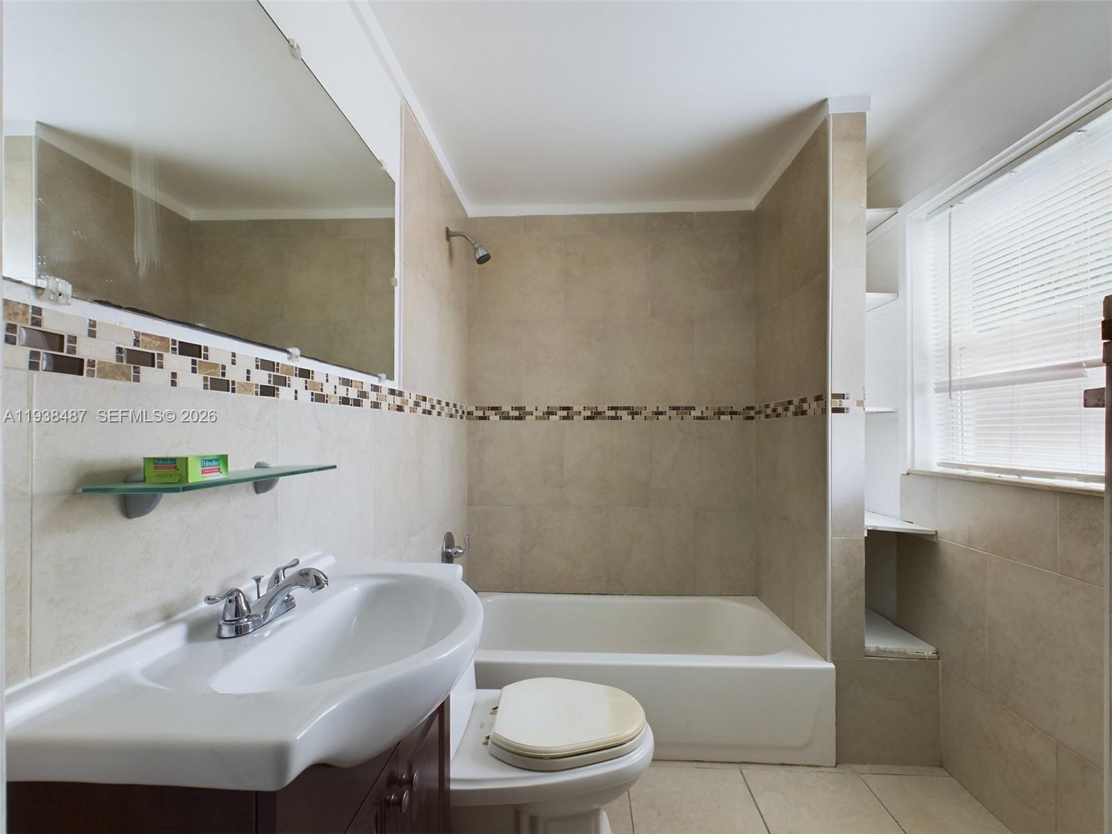 616 Southwest 8th Street, Unit 620 Homestead, FL 33030 - Photo 4 of 11 a bathroom with a sink toilet and shower