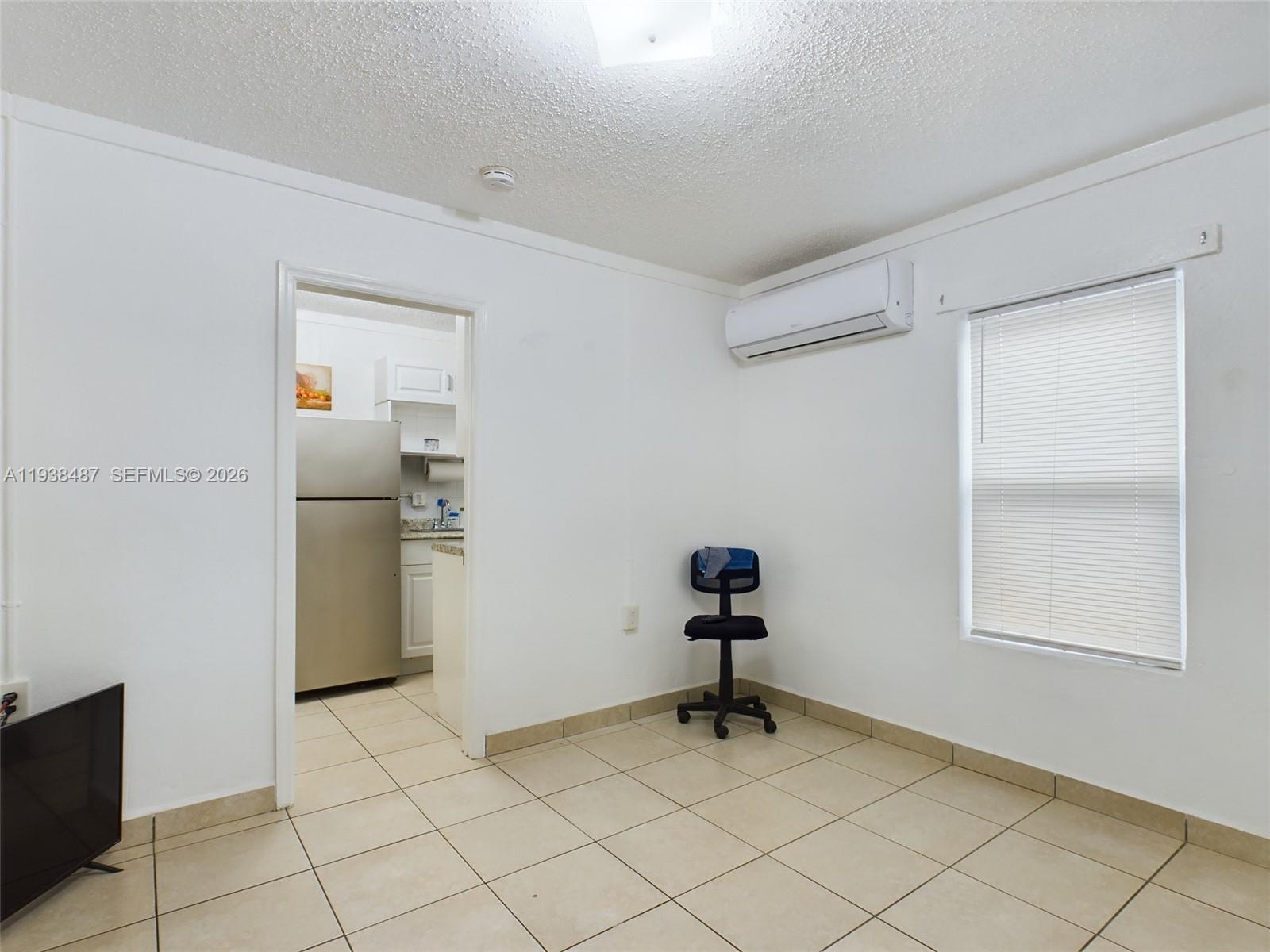 616 Southwest 8th Street, Unit 620 Homestead, FL 33030 - Photo 9 of 11 a view of an empty room and window