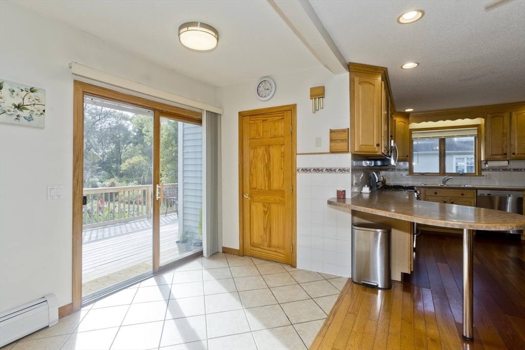 65 Verdugo Street West Springfield, MA 01089 - Photo 12 of 40 a view of a kitchen with furniture and wooden floor
