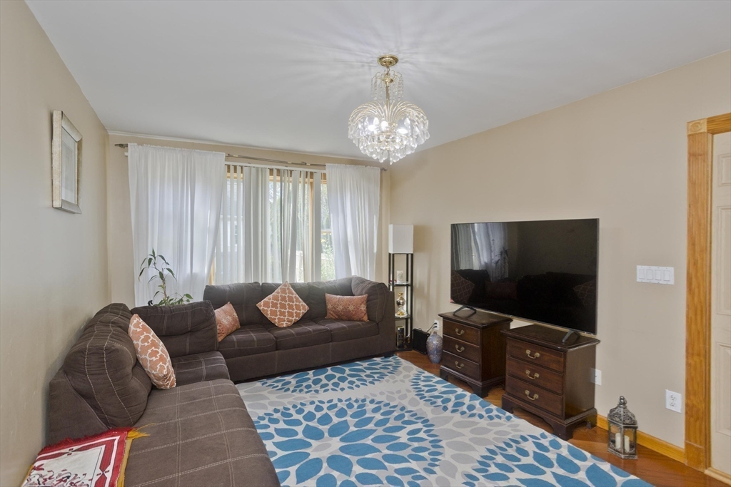 65 Verdugo Street West Springfield, MA 01089 - Photo 13 of 40 a living room with furniture and a flat screen tv