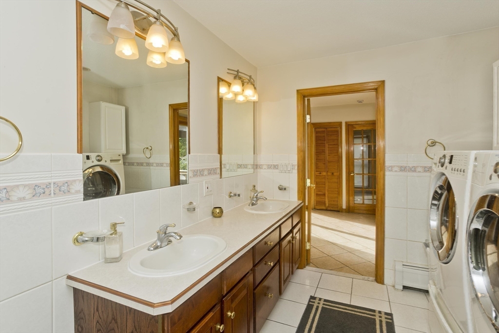 65 Verdugo Street West Springfield, MA 01089 - Photo 15 of 40 a bathroom with a bathtub a sink a mirror and shower