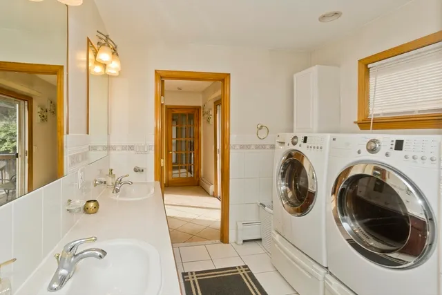 a en suite bathroom with a sink mirror vanity and toilet