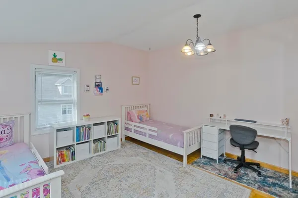 a living room with furniture and a dining table