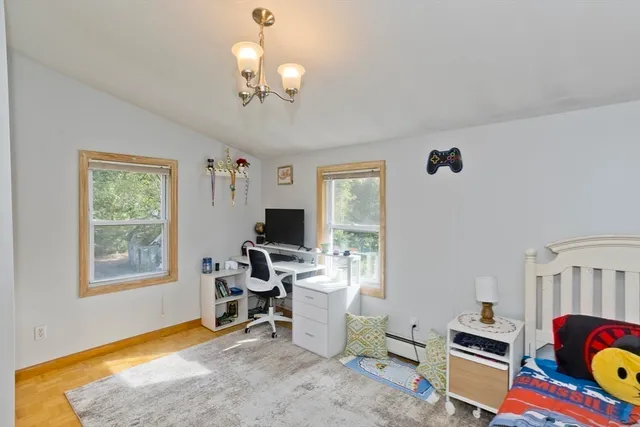 a workspace with furniture and a window