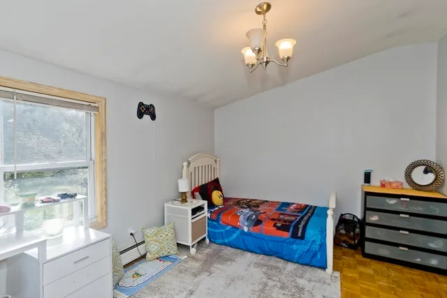 a bedroom with bed and window