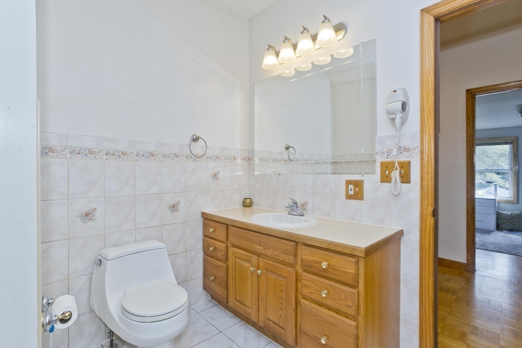 65 Verdugo Street West Springfield, MA 01089 - Photo 24 of 40 a spacious bathroom with a sink a toilet and a mirror