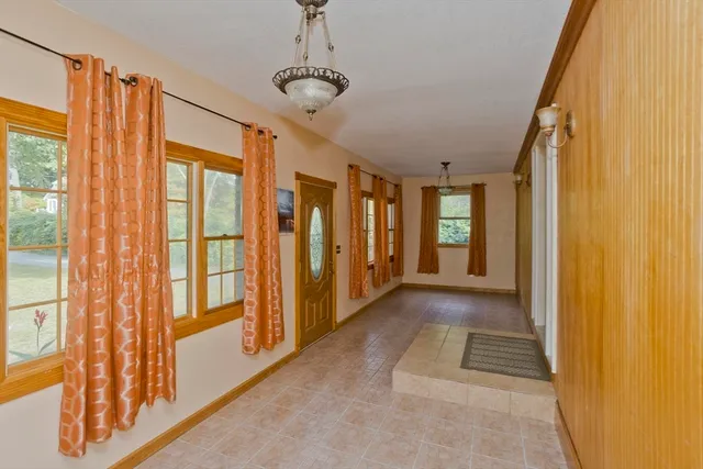 a view of balcony with wooden floor and fence