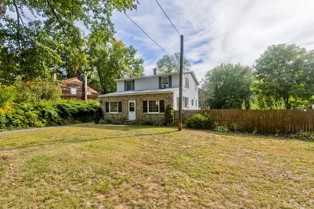 a kitchen with stainless steel appliances granite countertop a refrigerator and a stove