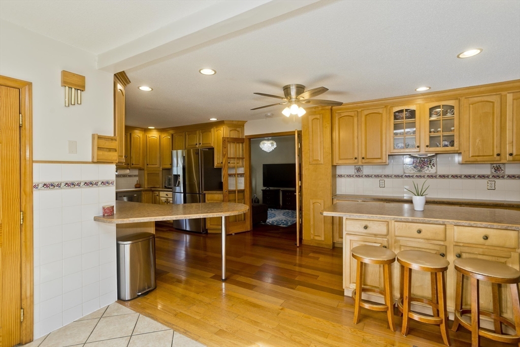 65 Verdugo Street West Springfield, MA 01089 - Photo 4 of 40 a view of a kitchen with kitchen island granite countertop wooden cabinets and stainless steel appliances