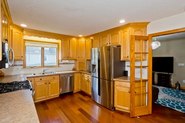 a view of a kitchen with a sink and cabinets