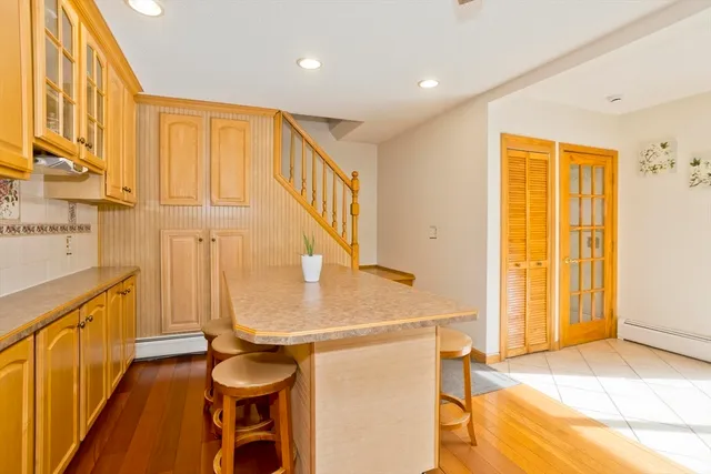 a view of a kitchen with a sink and cabinets