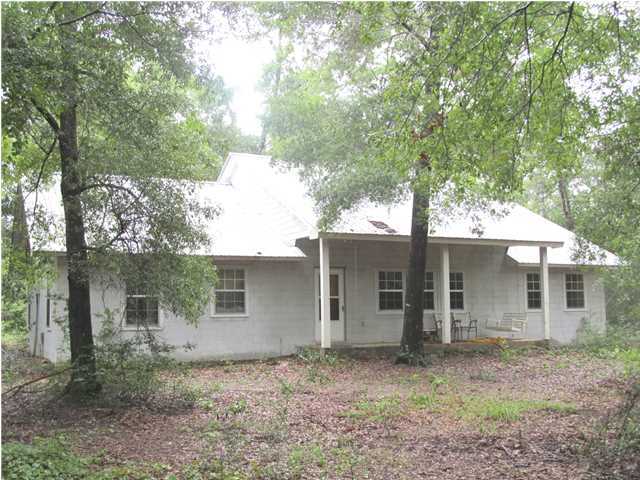 436 Thornton Road DeFuniak Springs, FL 32435 - Photo 1 of 13 front view of a house with a trees