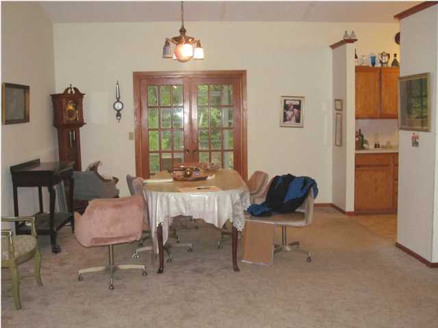 436 Thornton Road DeFuniak Springs, FL 32435 - Photo 6 of 13 a living room with furniture and a chandelier
