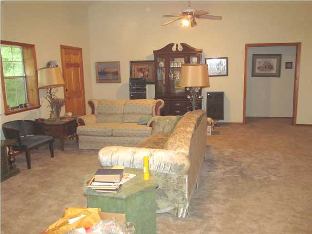 436 Thornton Road DeFuniak Springs, FL 32435 - Photo 9 of 13 a living room with furniture and a lamp