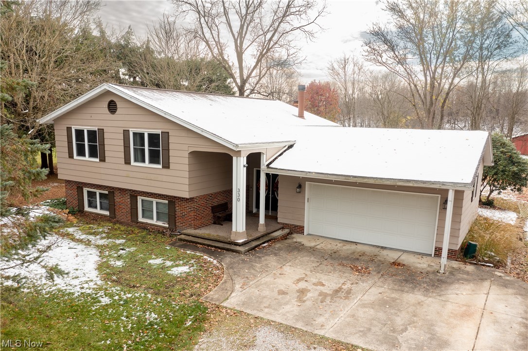 View of front of property featuring a garage