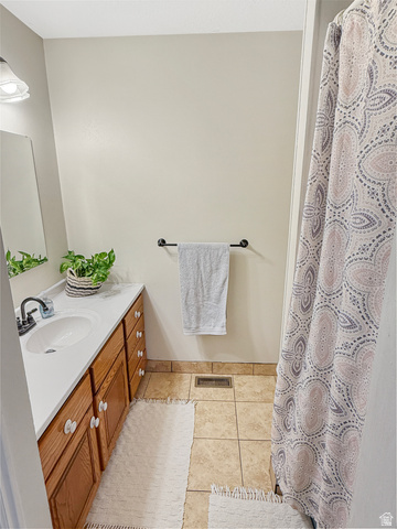 1716 Sagewood Road Price, UT 84501 - Photo 22 of 73 Full bathroom with vanity, light tile patterned floors, and a shower with shower curtain