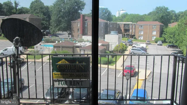 a view of backyard of house with outdoor seating