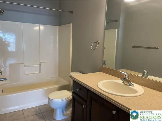 a bathroom with a sink toilet and bathtub