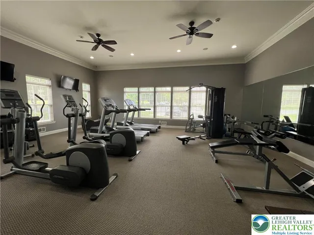 a large kitchen with a stove a sink and a microwave