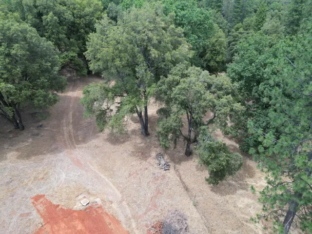 a view of a lake and green valley