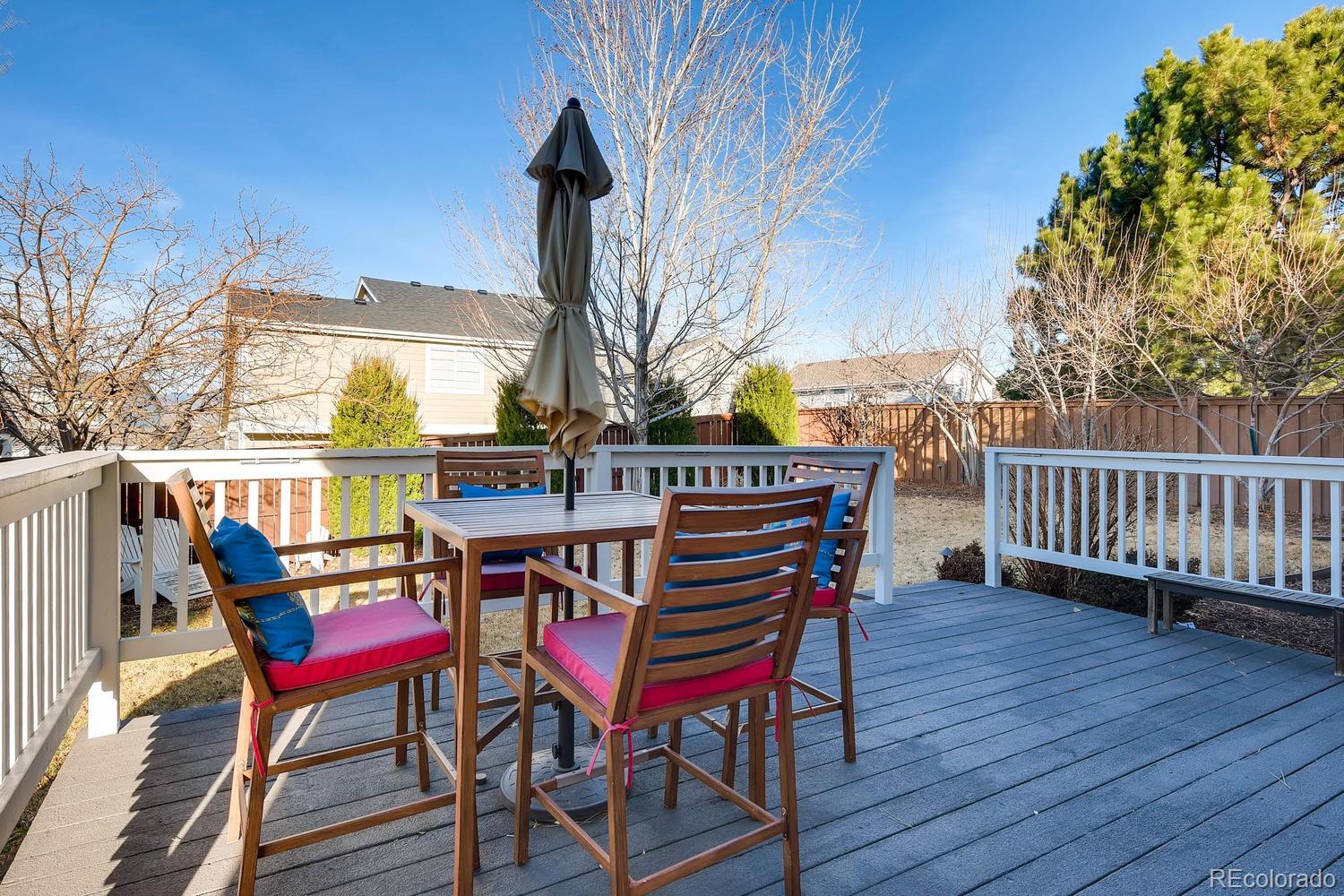 9825 South Thornbury Way Highlands Ranch, CO 80129 - Photo 23 of 27 a view of a chairs and table on the wooden floor