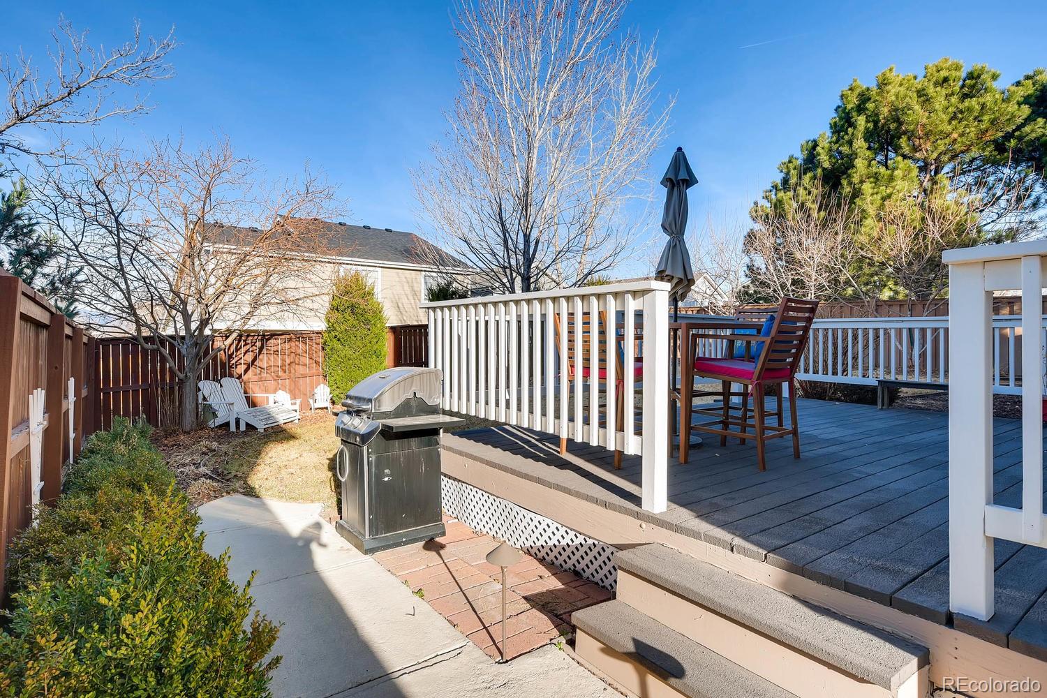 9825 South Thornbury Way Highlands Ranch, CO 80129 - Photo 25 of 27 a view of a patio with iron fence