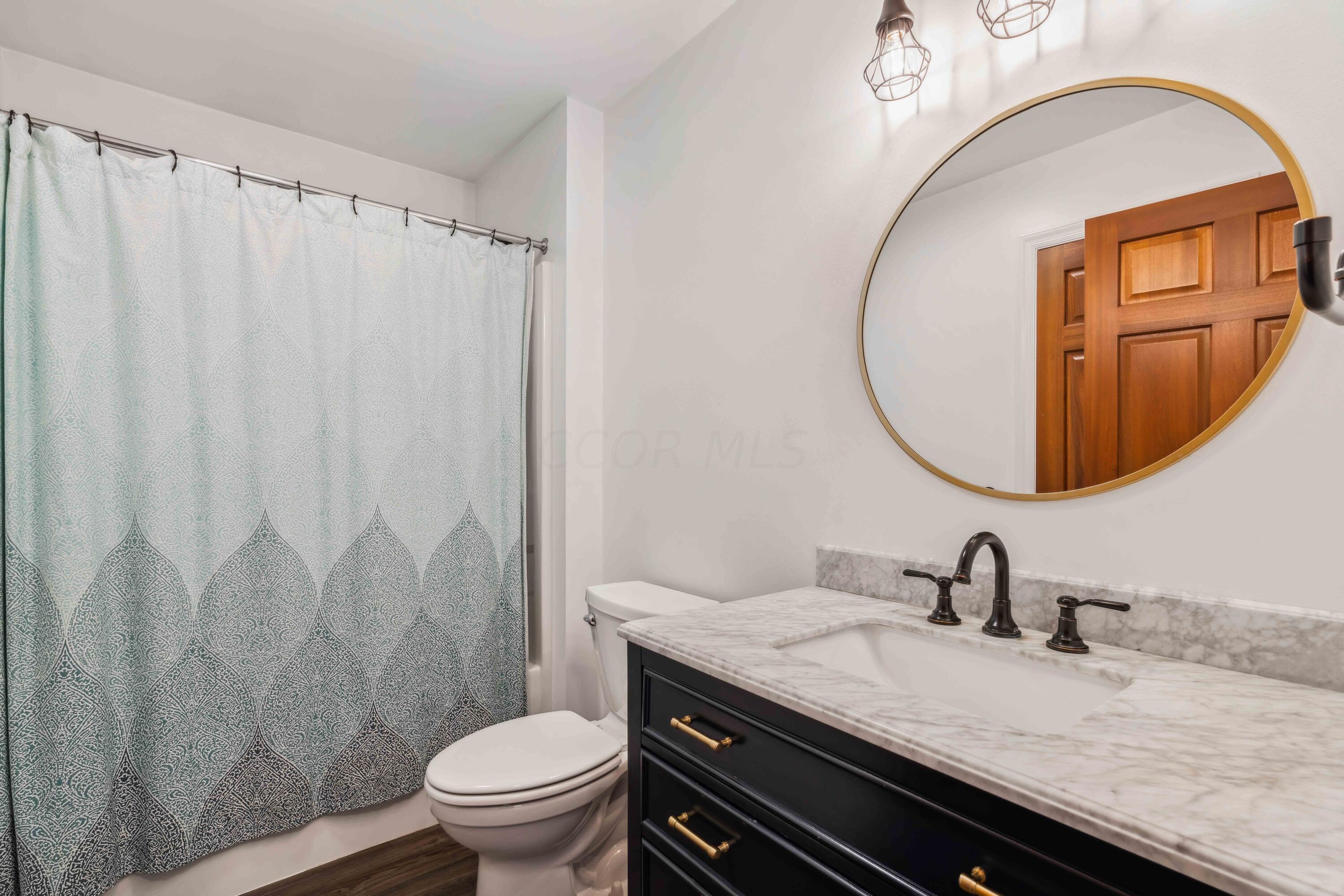 8884 Weiser Road Waldo, OH 43356 - Photo 23 of 37 Updated Bath with NEW marble top vanity, new lighting, new faucet and mirror!