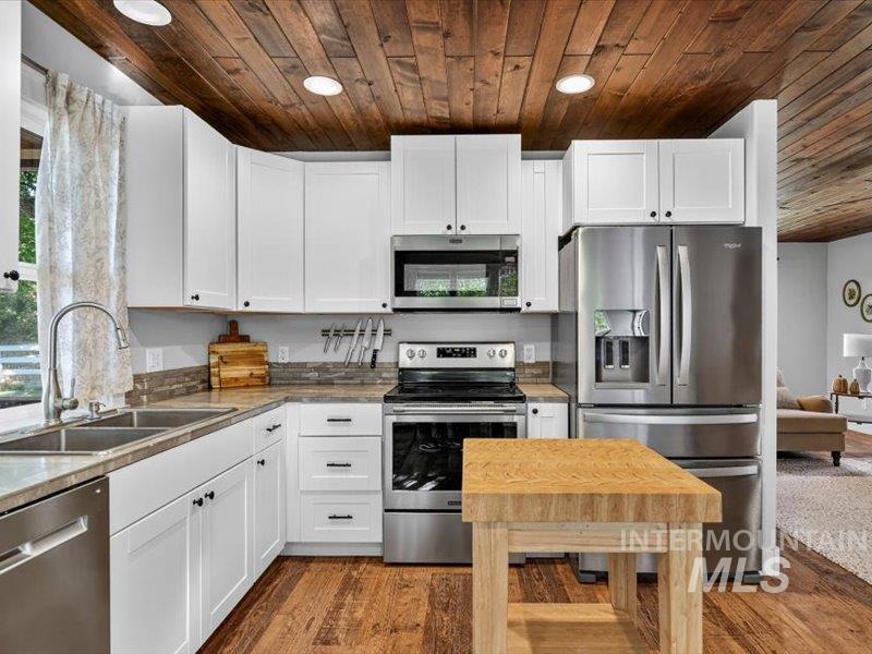 2651 Fruitvale Glendale Road Council, ID 83612 - Photo 12 of 24 Kitchen featuring wood-finish flooring and a wood-paneled ceiling