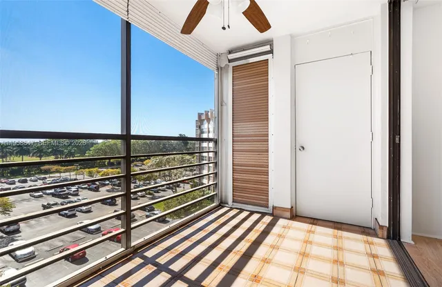 a view of a balcony with wooden floor