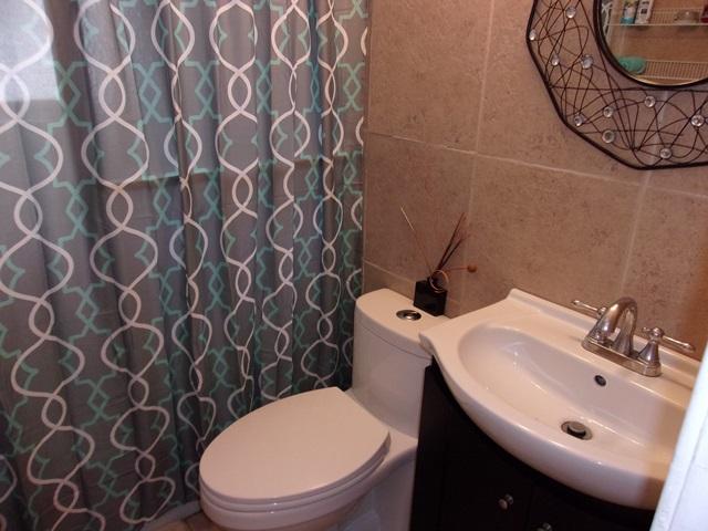 5588 South Rue Road West Palm Beach, FL 33415 - Photo 6 of 29 a bathroom with a sink and a mirror