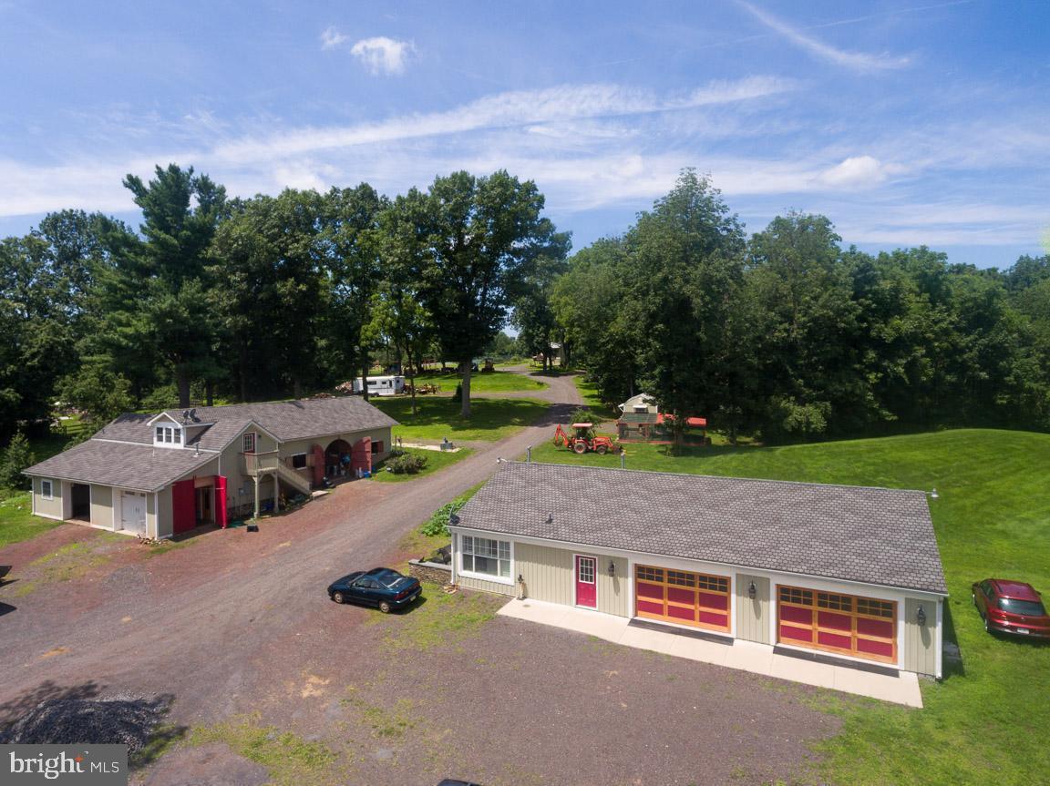 1515 Sugar Bottom Road Furlong, PA 18925 - Photo 69 of 96 an aerial view of a house with swimming pool and garden