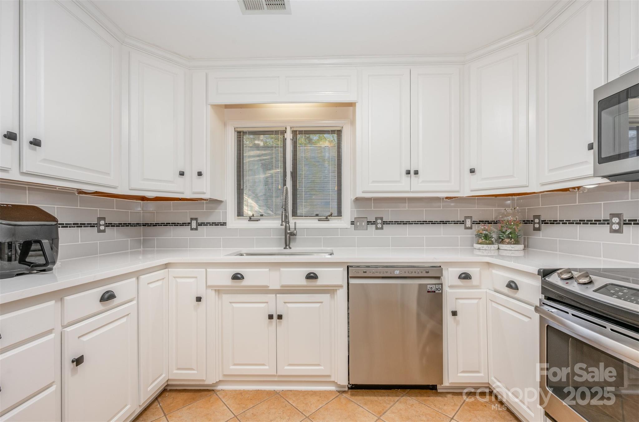 1500 Beth Haven Church Road Denver, NC 28037 - Photo 11 of 35 a kitchen with granite countertop white cabinets and white appliances