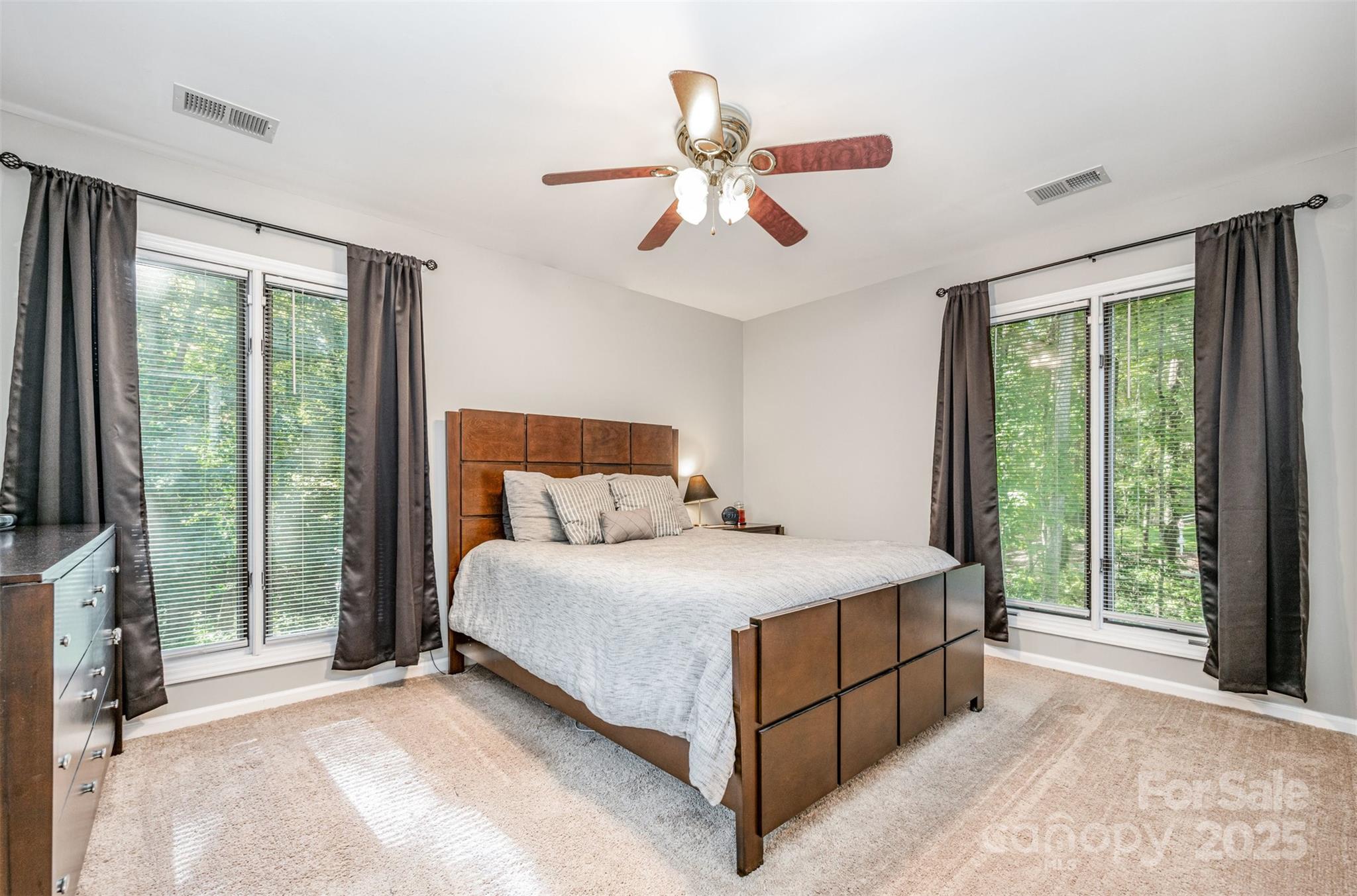 1500 Beth Haven Church Road Denver, NC 28037 - Photo 13 of 35 a bedroom with a large bed and a chandelier fan