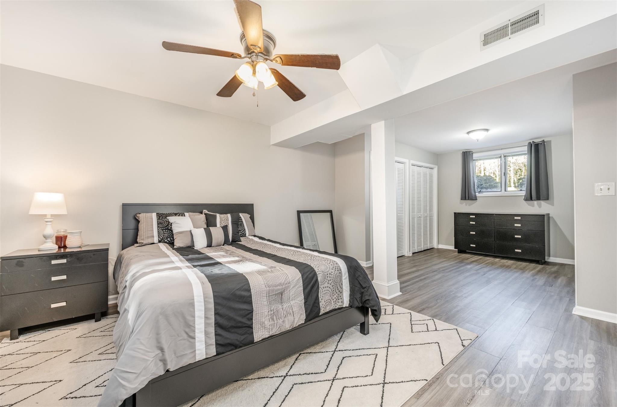 1500 Beth Haven Church Road Denver, NC 28037 - Photo 16 of 35 a spacious bedroom with a bed and ceiling fan