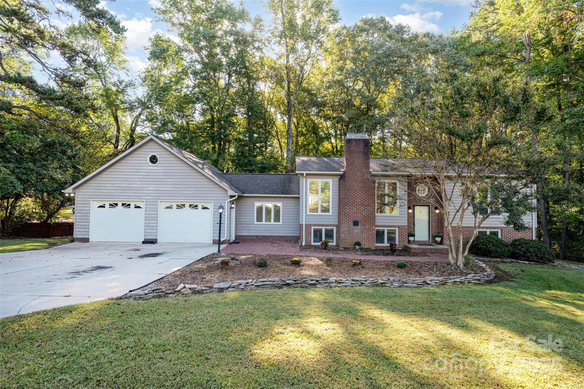 1500 Beth Haven Church Road Denver, NC 28037 - Photo 35 of 35 a front view of a house with a yard and trees