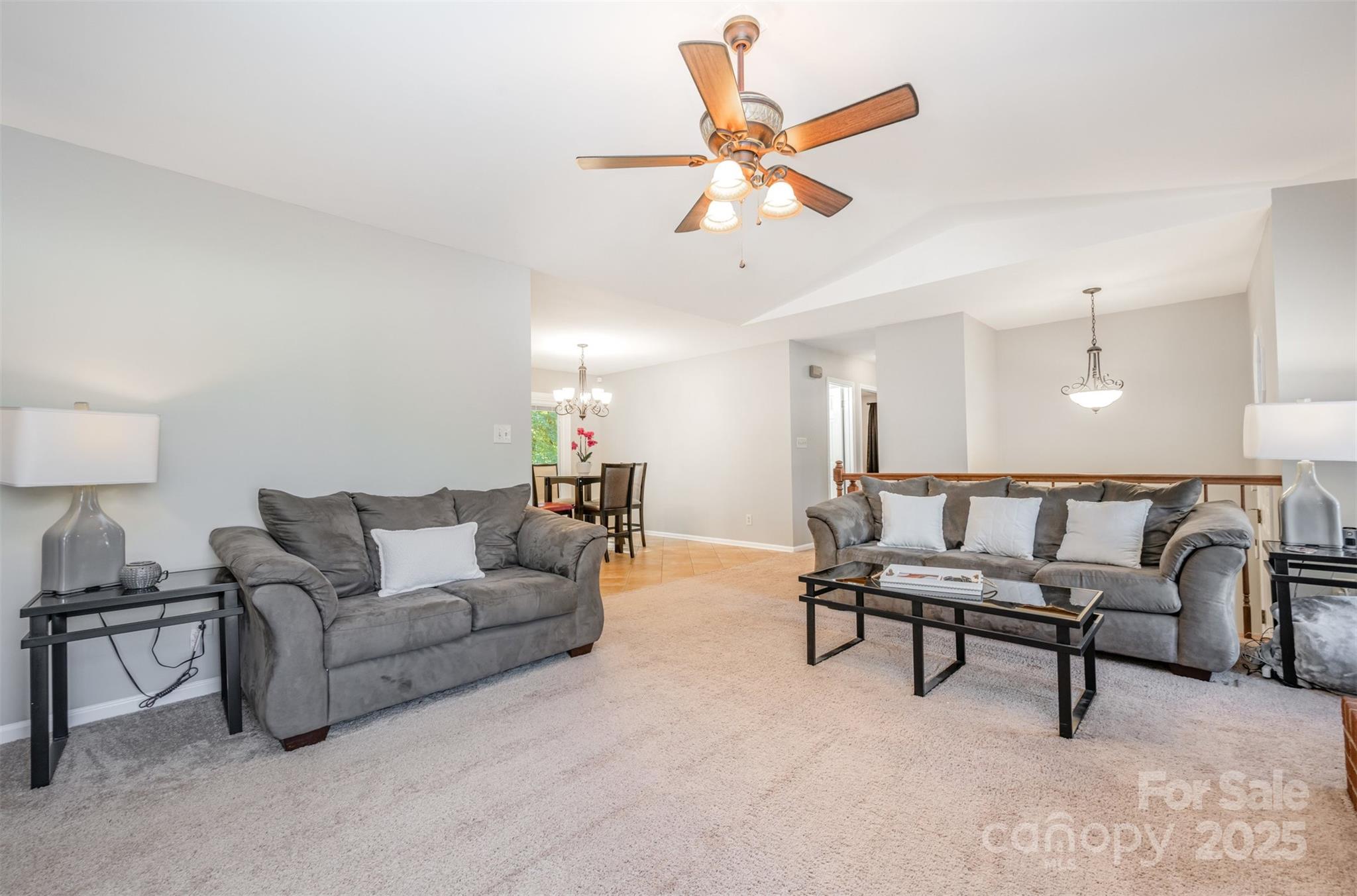 1500 Beth Haven Church Road Denver, NC 28037 - Photo 7 of 35 a living room with furniture and a ceiling fan