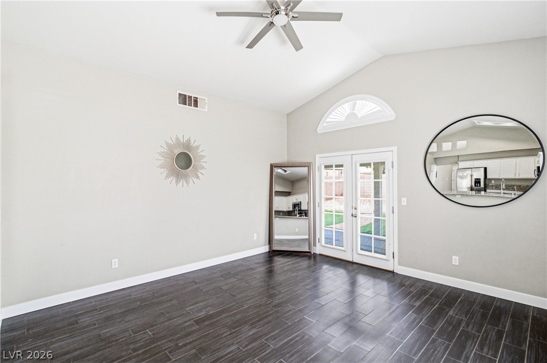 9523 Observer Street Las Vegas, NV 89123 - Photo 15 of 42 Vaulted ceilings and rich wood flooring define this adaptable interior space.
