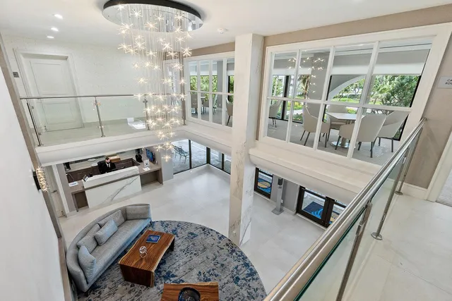 a view of a room with wooden floor and white walls