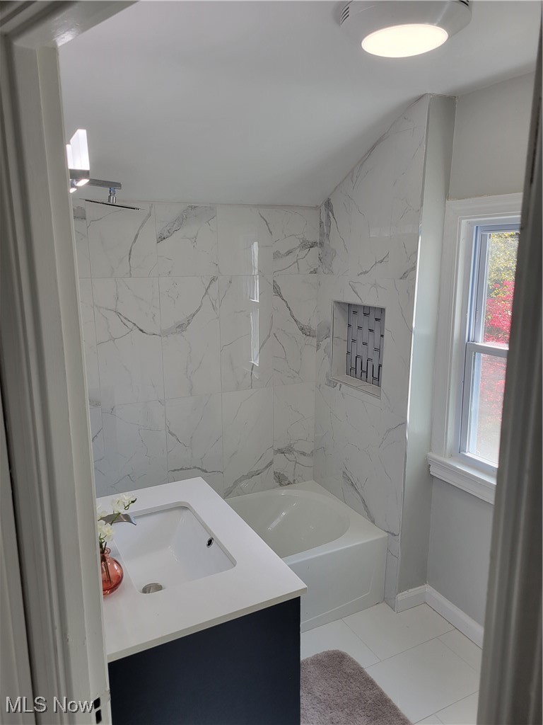 1685 Oakmount Road Cleveland, OH 44121 - Photo 13 of 23 Bathroom with vanity, tiled shower / bath, and tile patterned flooring