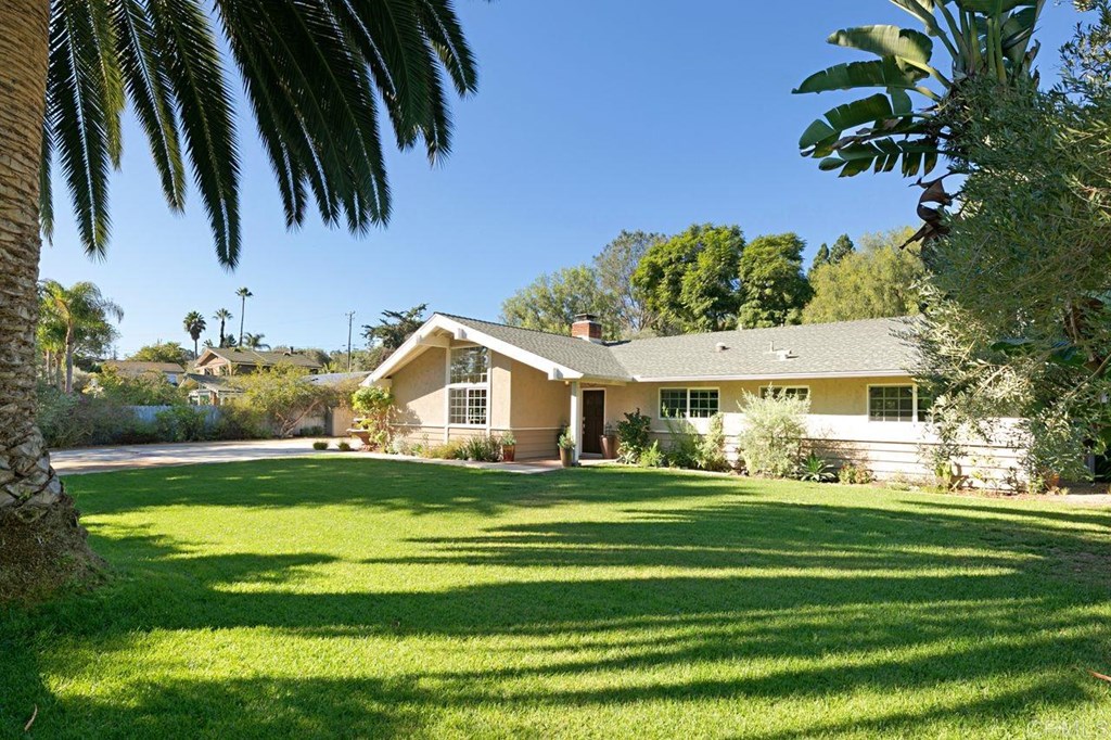 620 Rancho Santa Fe Road Encinitas, CA 92024 - Photo 1 of 1 a front view of a house with a garden