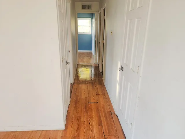a view of a bathroom with a hallway