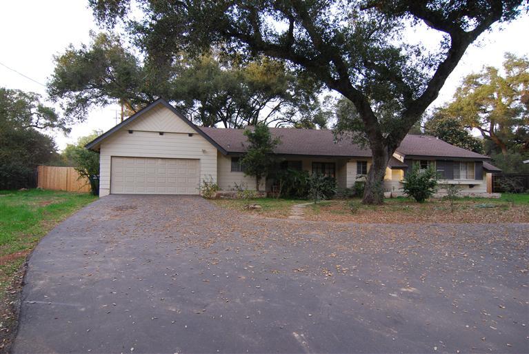712 Cuyama Road Ojai, CA 93023 - Photo 1 of 21 a front view of a house with a yard and garage