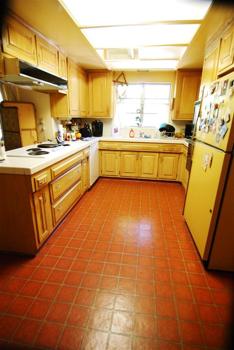 712 Cuyama Road Ojai, CA 93023 - Photo 11 of 21 a kitchen with stainless steel appliances a sink a stove top oven cabinets a counter top space and a large window