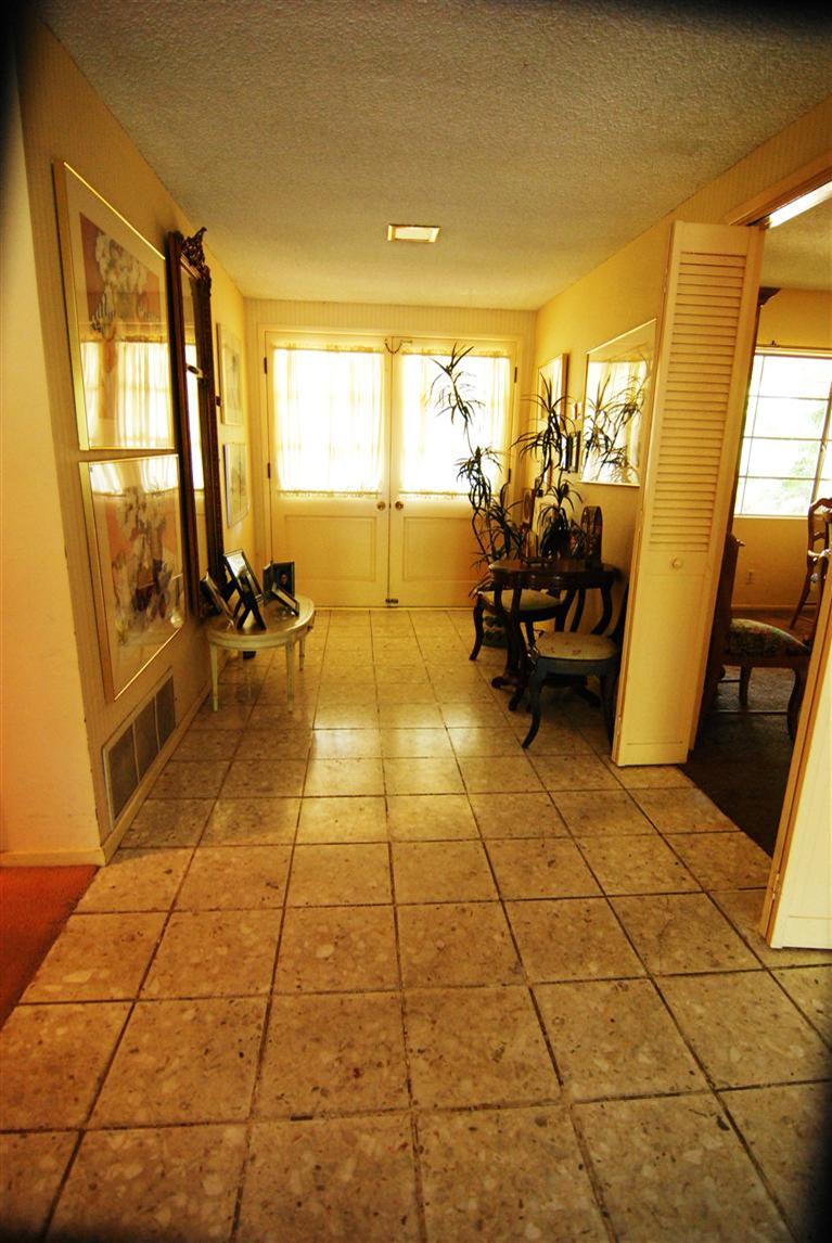 712 Cuyama Road Ojai, CA 93023 - Photo 13 of 21 a living room with patio furniture and a floor to ceiling window