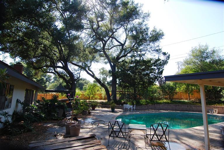 712 Cuyama Road Ojai, CA 93023 - Photo 4 of 21 a view of a patio with table and chairs under an umbrella