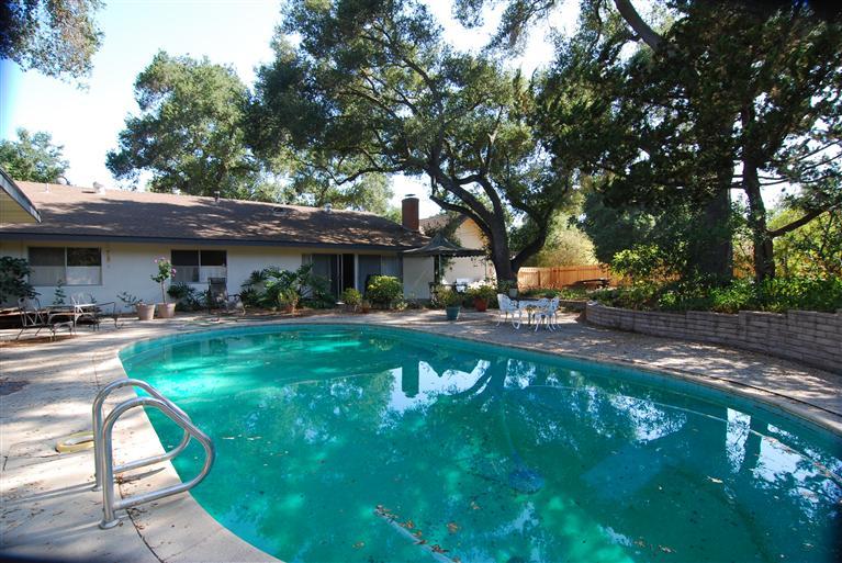 712 Cuyama Road Ojai, CA 93023 - Photo 9 of 21 a view of patio with a table chairs and a small yard