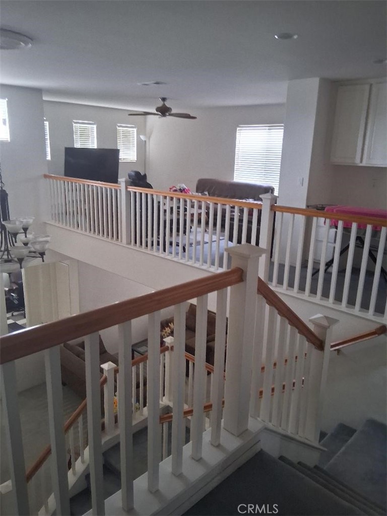 26928 Commons Moreno Valley Moreno Valley, CA 92555 - Photo 2 of 12 a view of staircase with railing and a rug