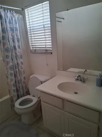 a bedroom with a bed and a furniture